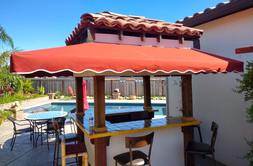 Second slide, fabric awning around a residential poolside bar installation by Goodwin-Cole.