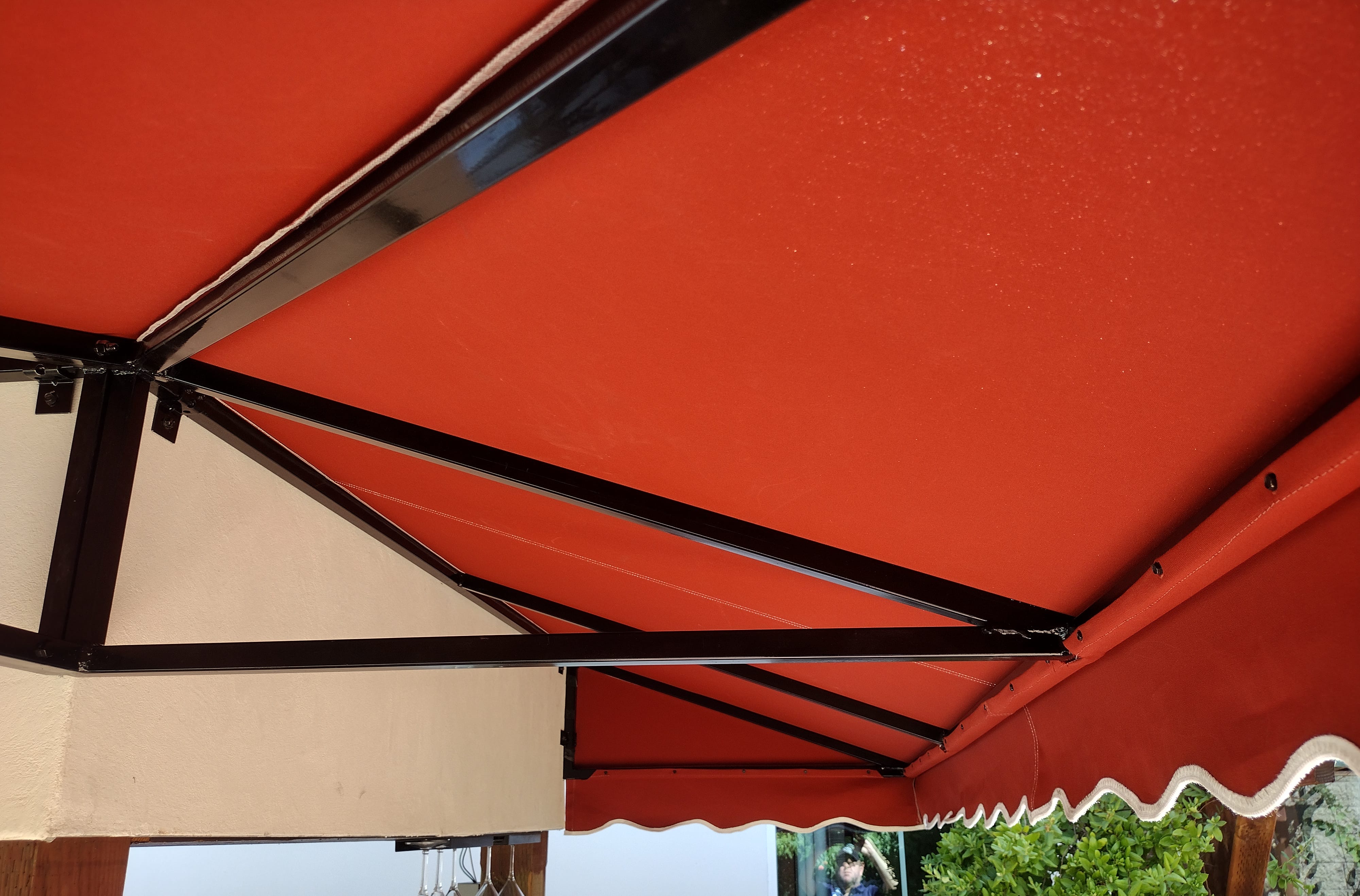 Third slide, fabric awning around a residential poolside bar installation by Goodwin-Cole.