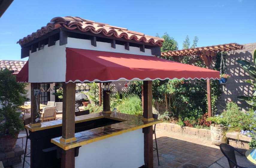 Fourth slide, fabric awning around a residential poolside bar view from the back installation by Goodwin-Cole.