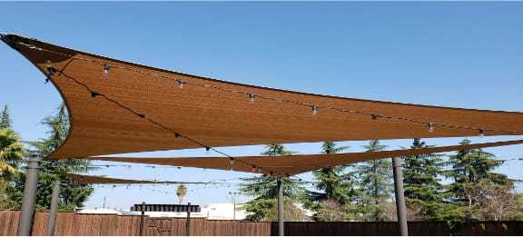 Shade sails outside of a hilton hotel