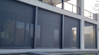 Residential balcony with exterior roller shades